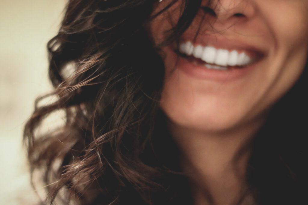 Picture of a woman with a smile full of beauty and helth. Beauty and Health are closely related to Ayurveda and without health, beauty cannot be maintained.