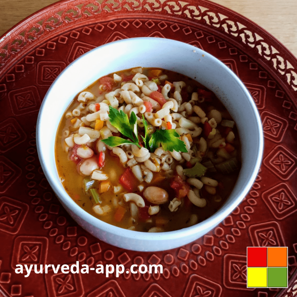 Photo of a white bowl of vegetable and bean soup on top of a decorated red tray.